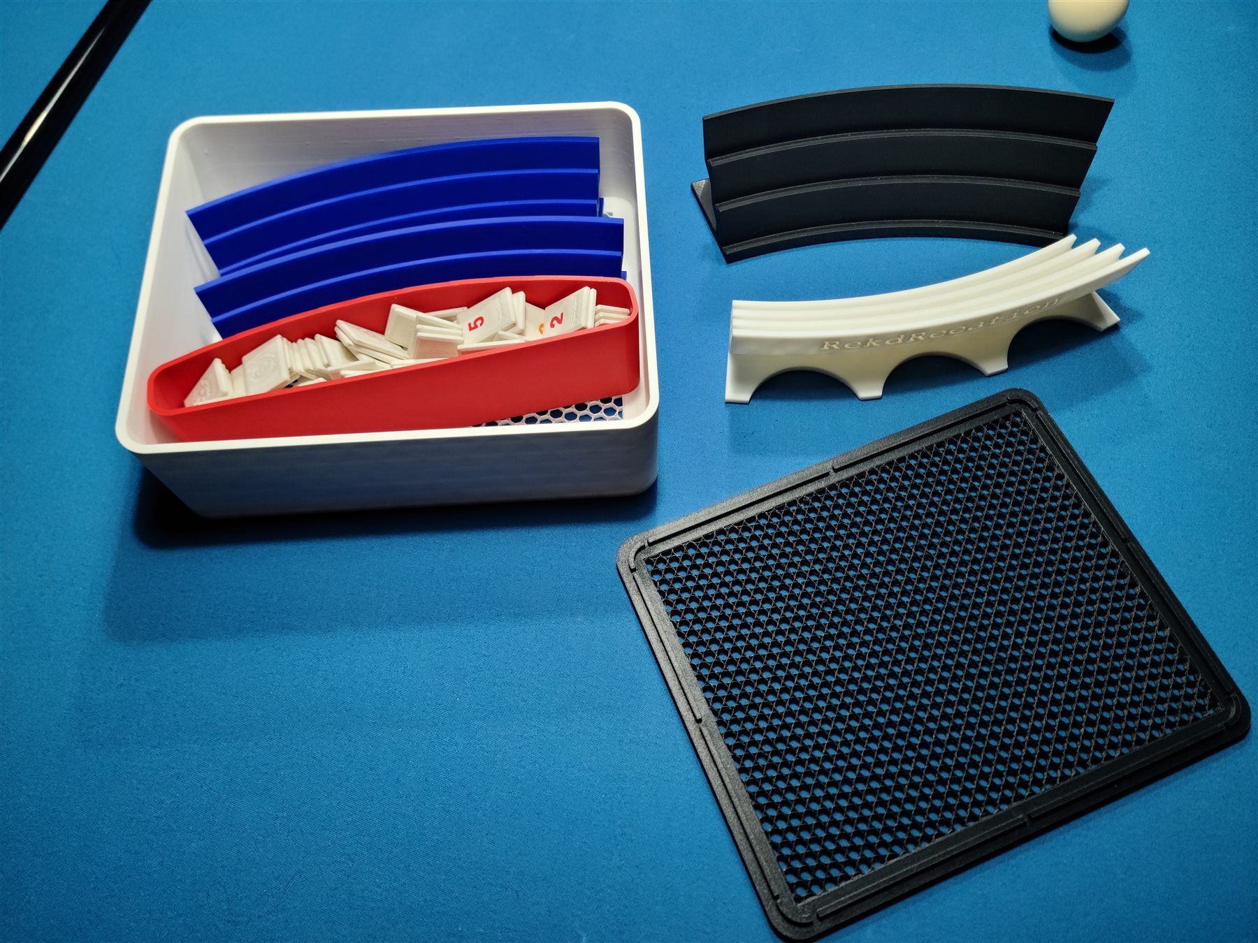 MeldVault 4 box, lid, and racks arranged on a table.